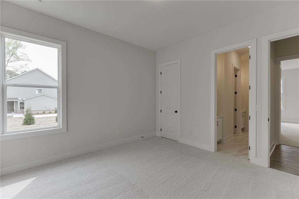 5410 Settingdown Road Cumming, GA 30041 - Photo 12 of 47 a view of an empty room with a window