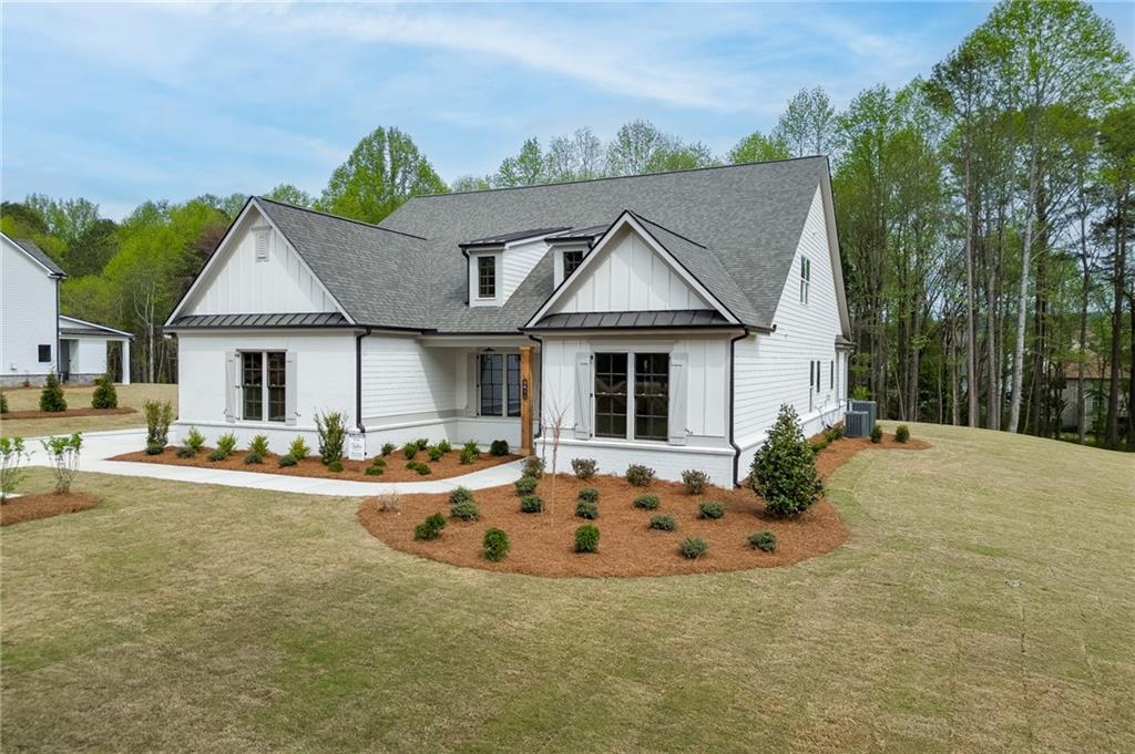 5410 Settingdown Road Cumming, GA 30041 - Photo 3 of 47 a front view of a house with swimming pool