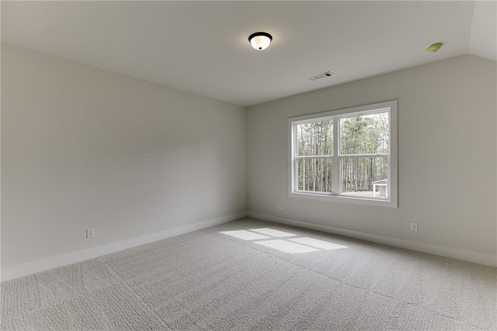 5410 Settingdown Road Cumming, GA 30041 - Photo 39 of 47 an empty room with windows