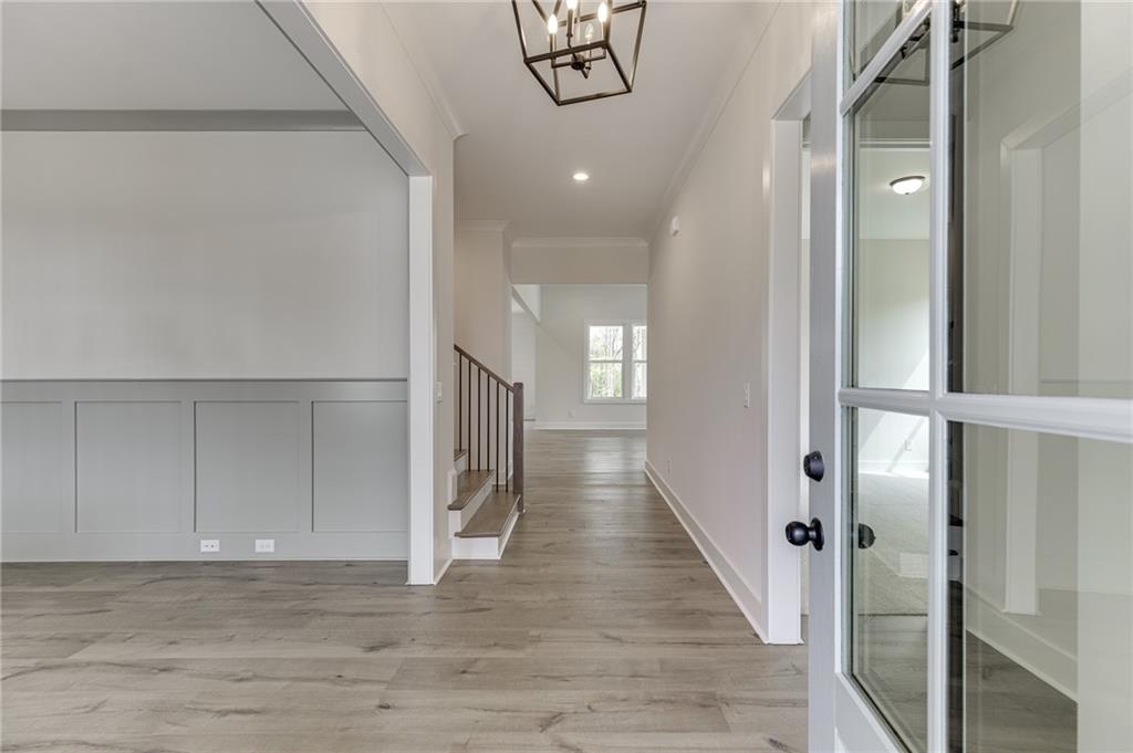 5410 Settingdown Road Cumming, GA 30041 - Photo 4 of 47 a view of a hallway with wooden floor
