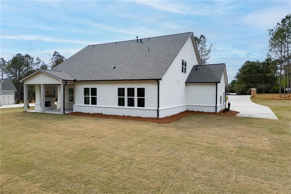 5410 Settingdown Road Cumming, GA 30041 - Photo 44 of 47 a house with trees in front of it