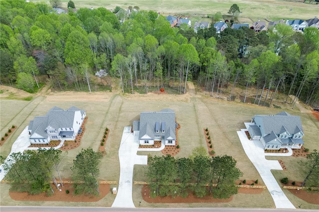 5410 Settingdown Road Cumming, GA 30041 - Photo 45 of 47 an aerial view of a house with a yard basket ball court and outdoor seating