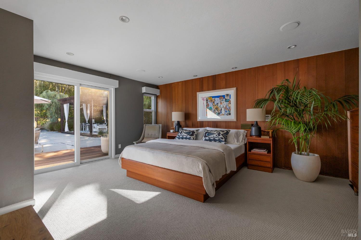 2563 Laguna Road Santa Rosa, CA 95401 - Photo 35 of 63 The sumptuous primary suite gives directly onto the pool; its floors warm underfoot through radiant heating, its bathroom unhurried enough to feel like a private spa.