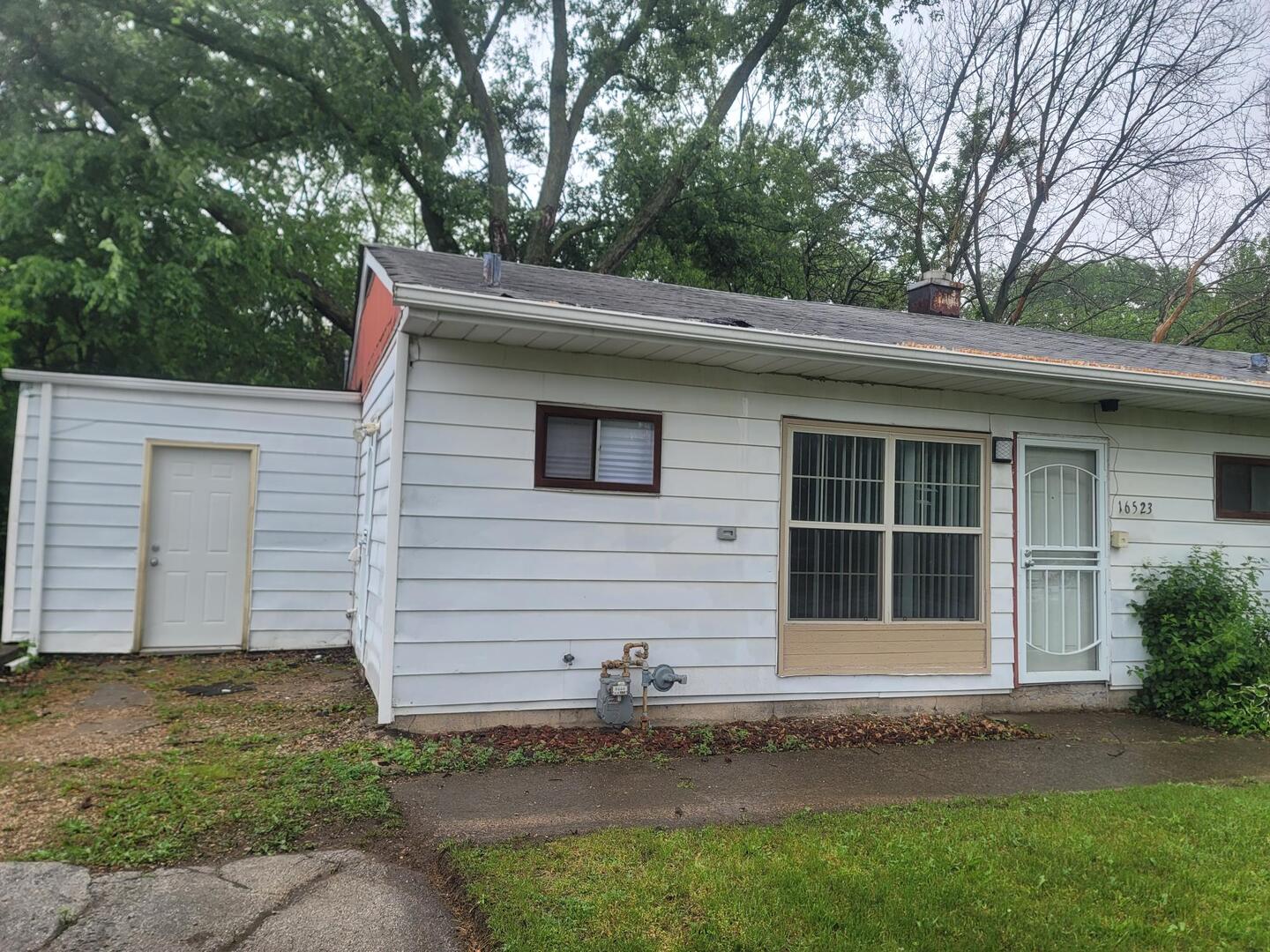 16523 Spaulding Avenue Markham, IL 60428 - Photo 4 of 15 a view of house with backyard