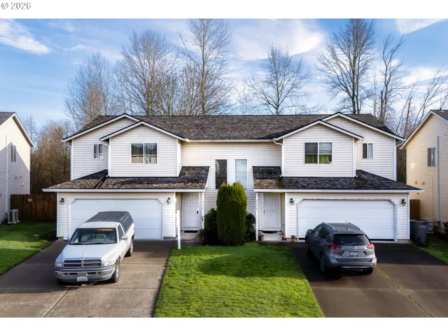 a car parked in front of white house