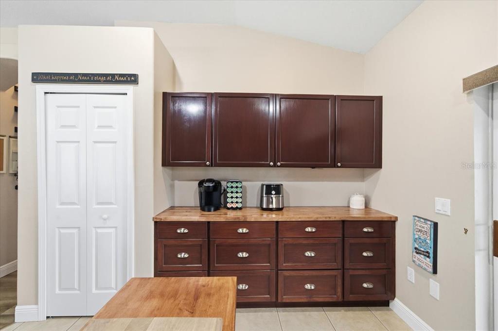 18641 Rolling Hills Loop Hudson, FL 34667 - Photo 20 of 44 a kitchen with stainless steel appliances granite countertop a refrigerator a sink dishwasher and cabinets with wooden floor