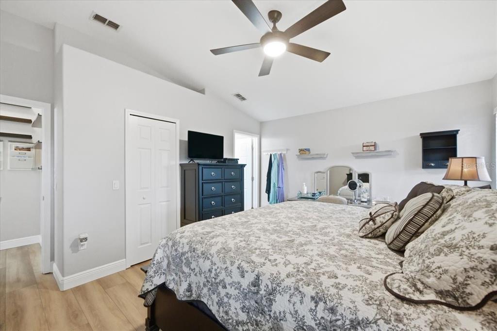 18641 Rolling Hills Loop Hudson, FL 34667 - Photo 24 of 44 a bedroom with a bed and a flat screen tv