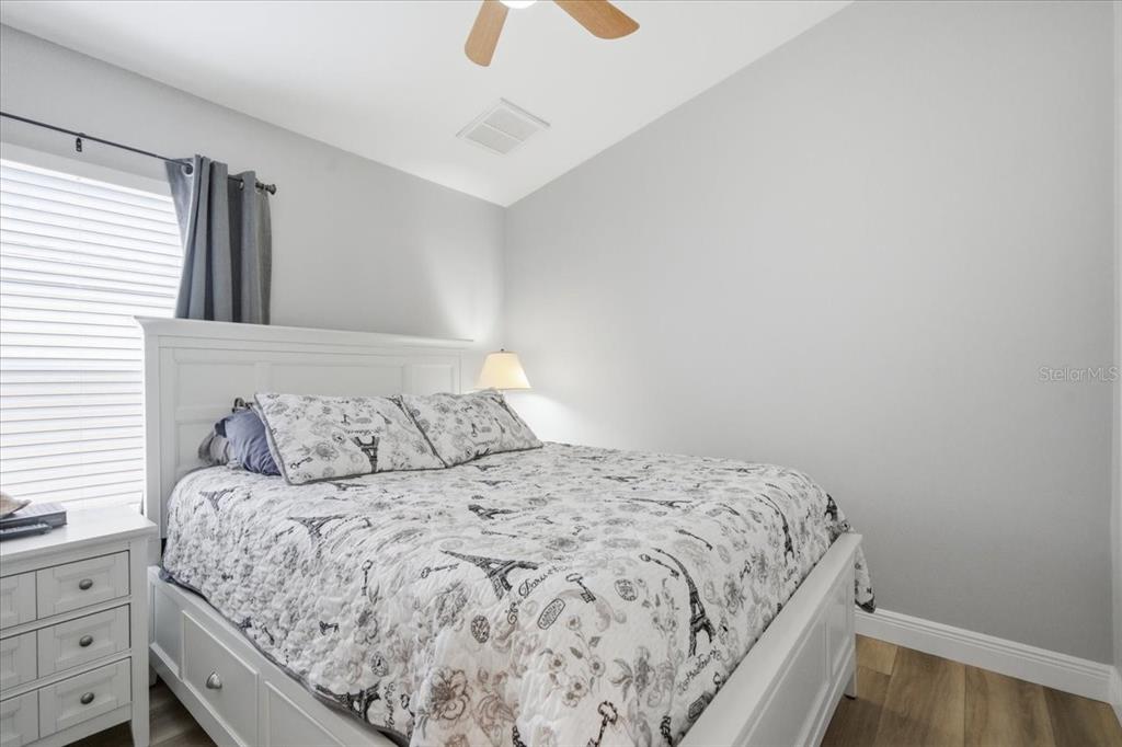 18641 Rolling Hills Loop Hudson, FL 34667 - Photo 27 of 44 a bedroom with a bed and a dresser