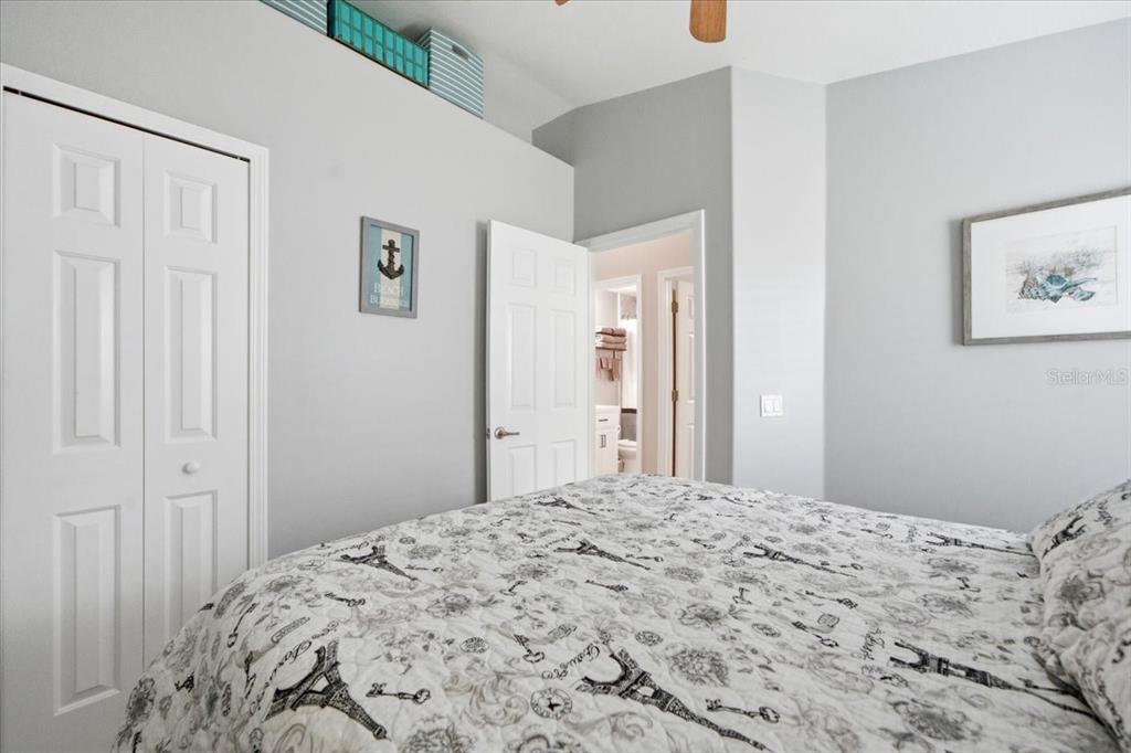 18641 Rolling Hills Loop Hudson, FL 34667 - Photo 28 of 44 a bedroom with a bed and painting on the wall