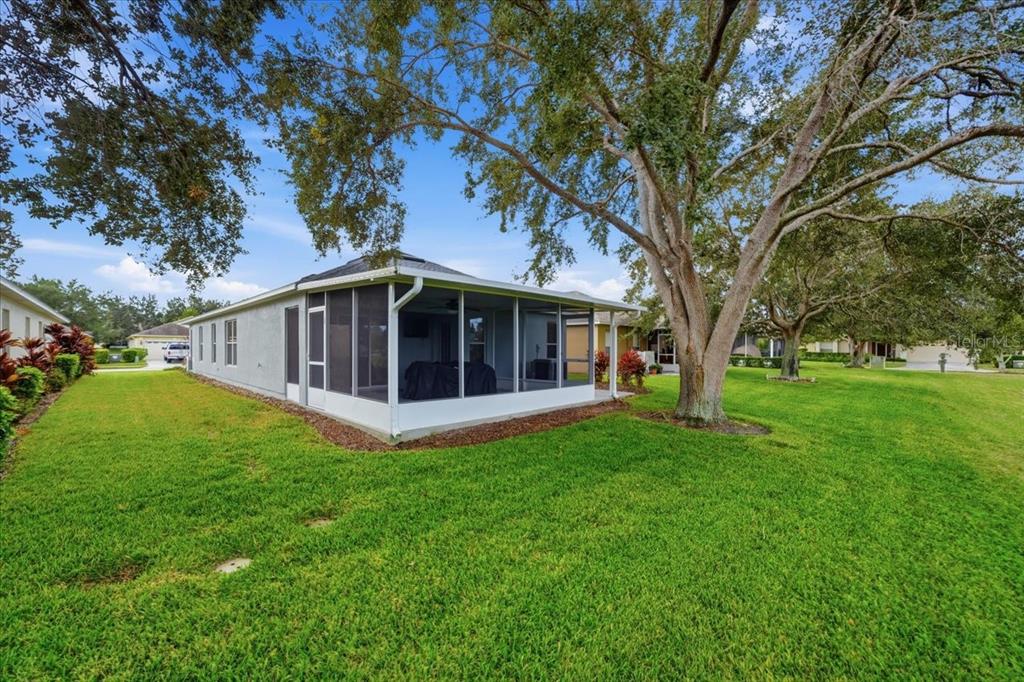 18641 Rolling Hills Loop Hudson, FL 34667 - Photo 35 of 44 a view of a house with a yard
