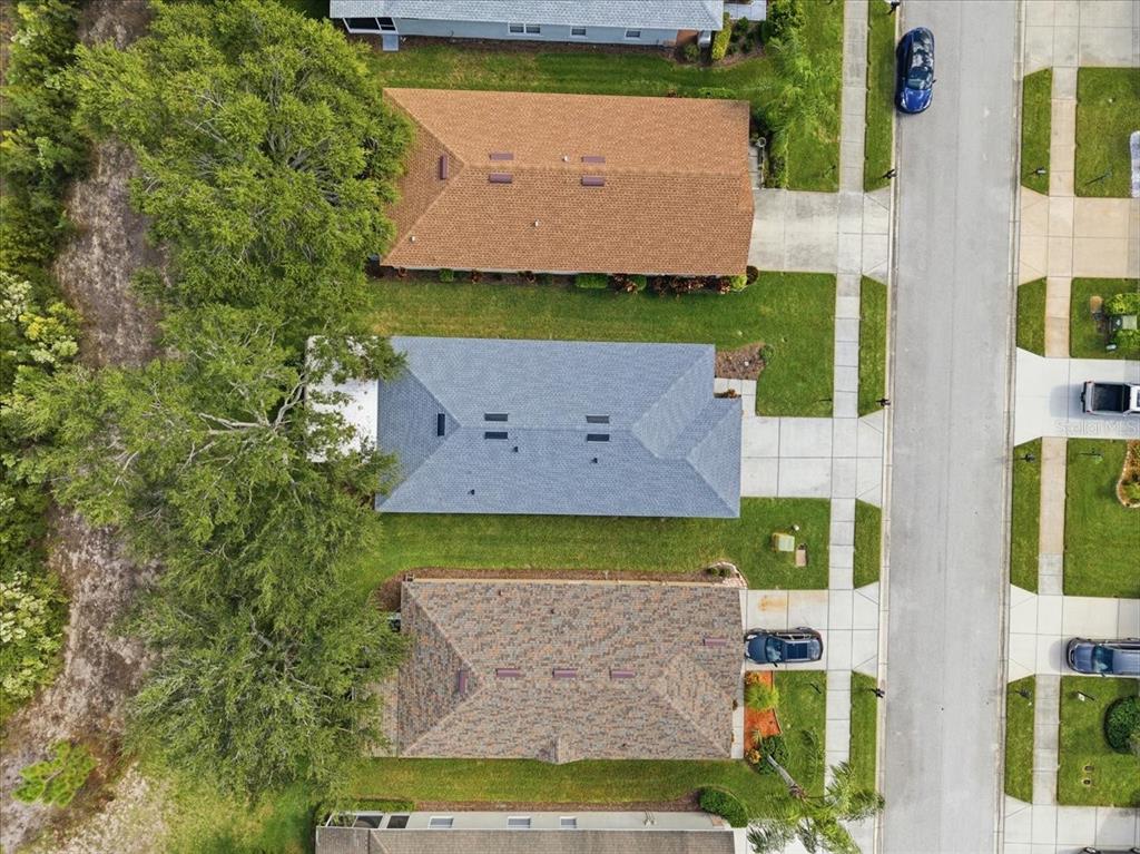 18641 Rolling Hills Loop Hudson, FL 34667 - Photo 41 of 44 an aerial view of a house with a yard