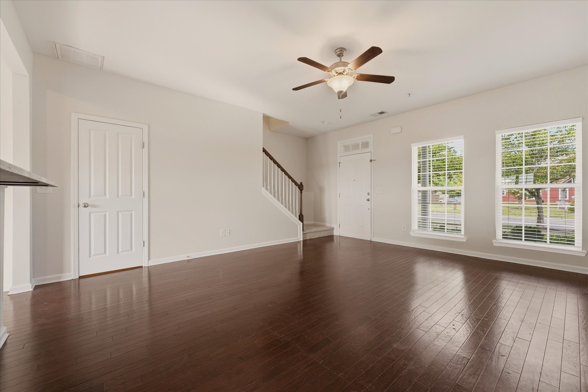 2050 Hemlock Drive Spring Hill, TN 37174 - Photo 7 of 48 a view of an empty room with wooden floor and a window