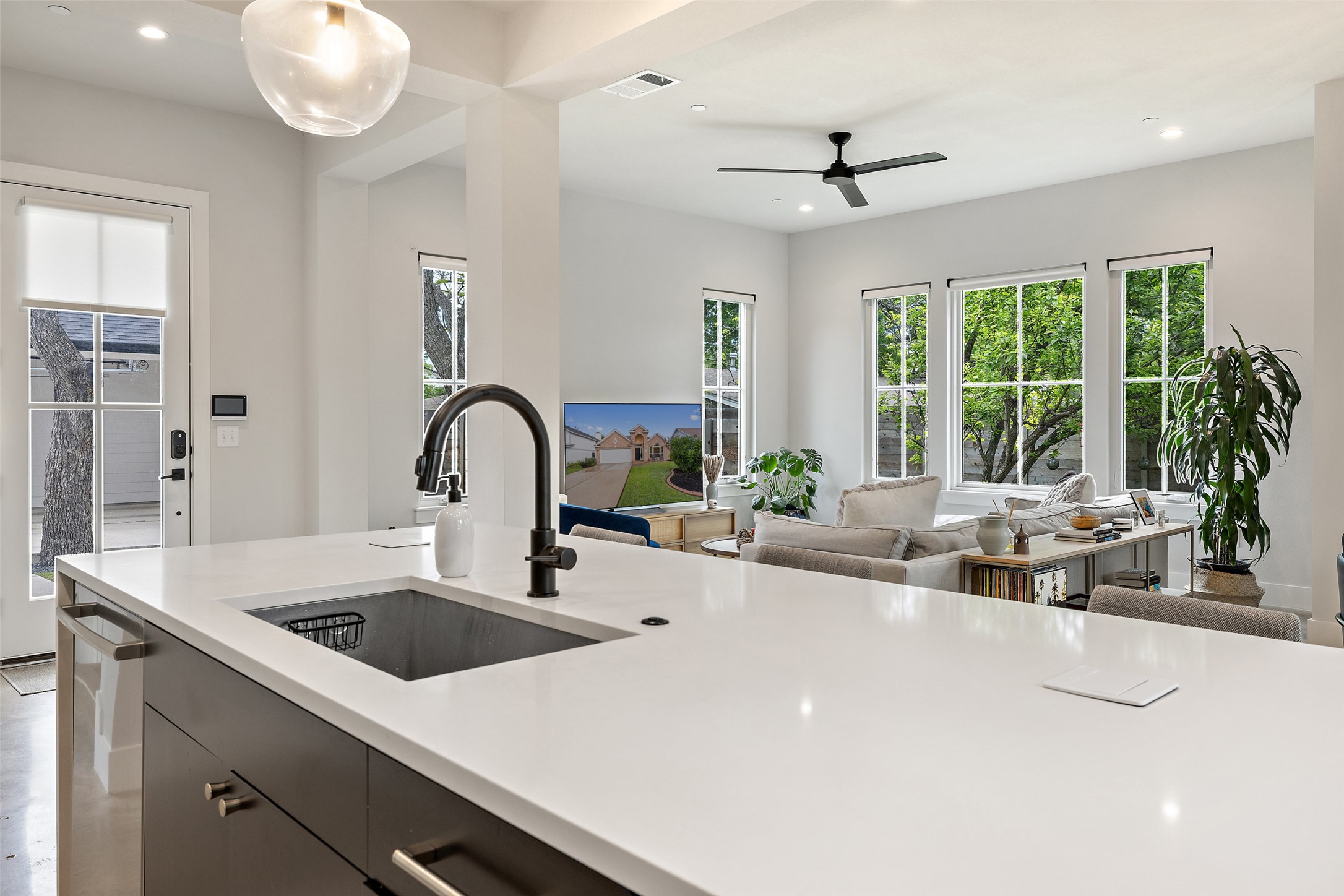 1504 Ruth Avenue, Unit 3 Austin, TX 78757 - Photo 16 of 39 An open concept kitchen seamlessly transitions into a well-lit living area, perfect for modern living and entertaining.