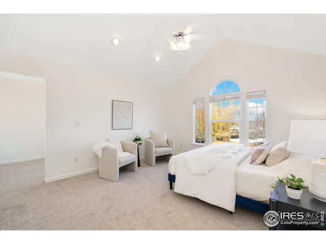 a bedroom with bed and window