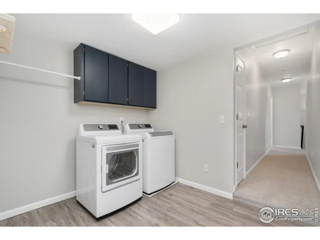 a view of a hallway with washer and dryer