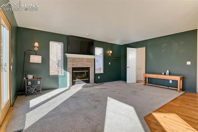 a bedroom with a bed and a fireplace