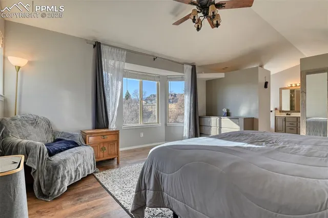 a spacious bedroom with a bed and window