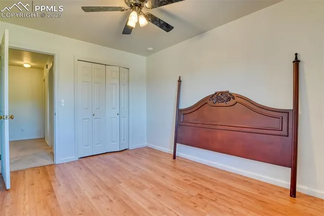 a room with a bed and a chandelier