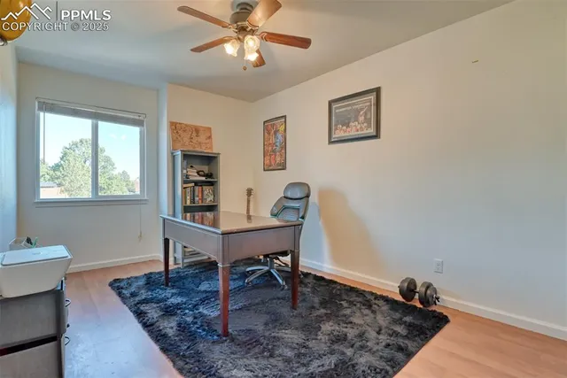a workspace with furniture window and wooden floor