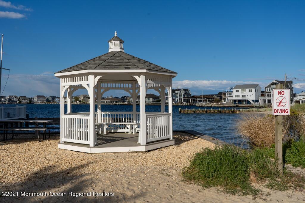 119 Johnson Road Lavallette, NJ 08735 - Photo 22 of 24 a view of a house with wooden deck