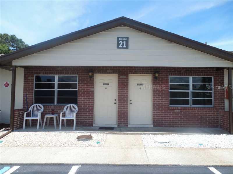 24862 Us 19 Street, Unit 2103 Clearwater, FL 33763 - Photo 1 of 1 a front view of a house with large windows