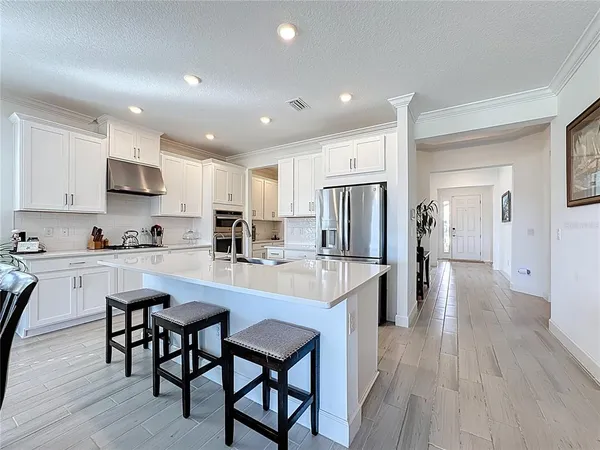 a kitchen with a stove and cabinets