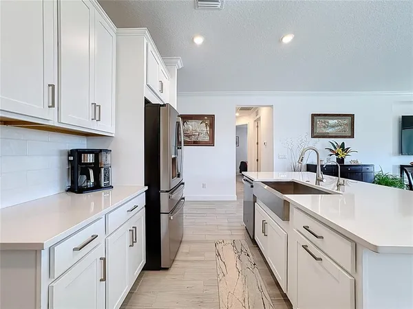 a view of a living room and an empty room
