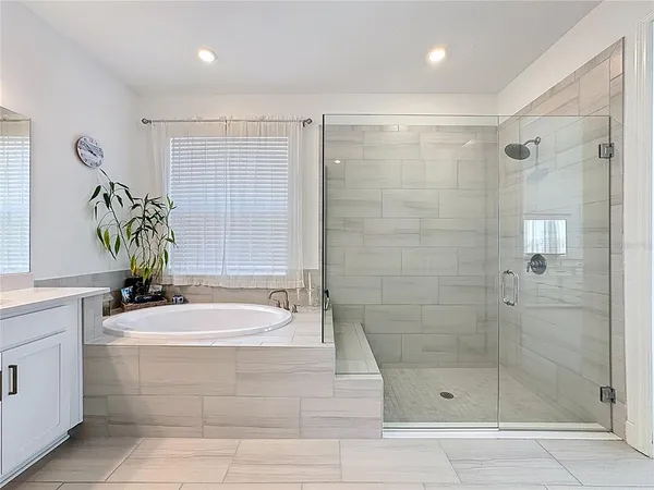 an aerial view of a residential houses with outdoor space