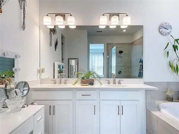 an aerial view of a house with a swimming pool a yard and lake view