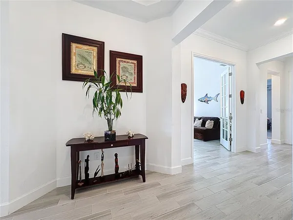 an aerial view of residential houses with outdoor space and lake view