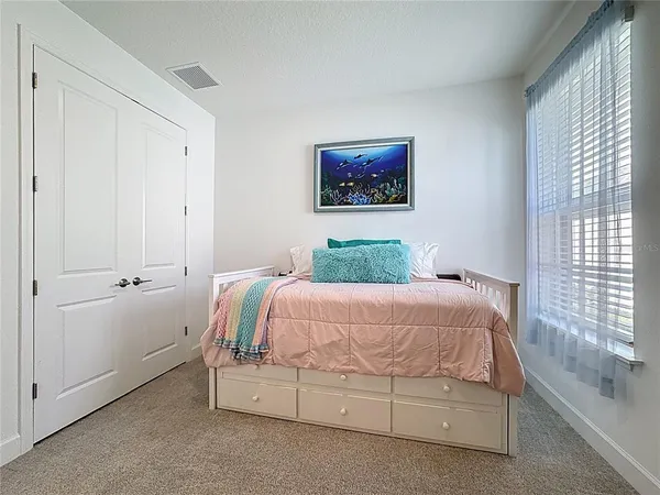 an aerial view of a swimming pool with seating area