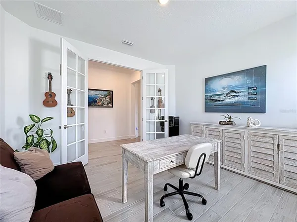 a kitchen with granite countertop a sink stainless steel appliances and cabinets