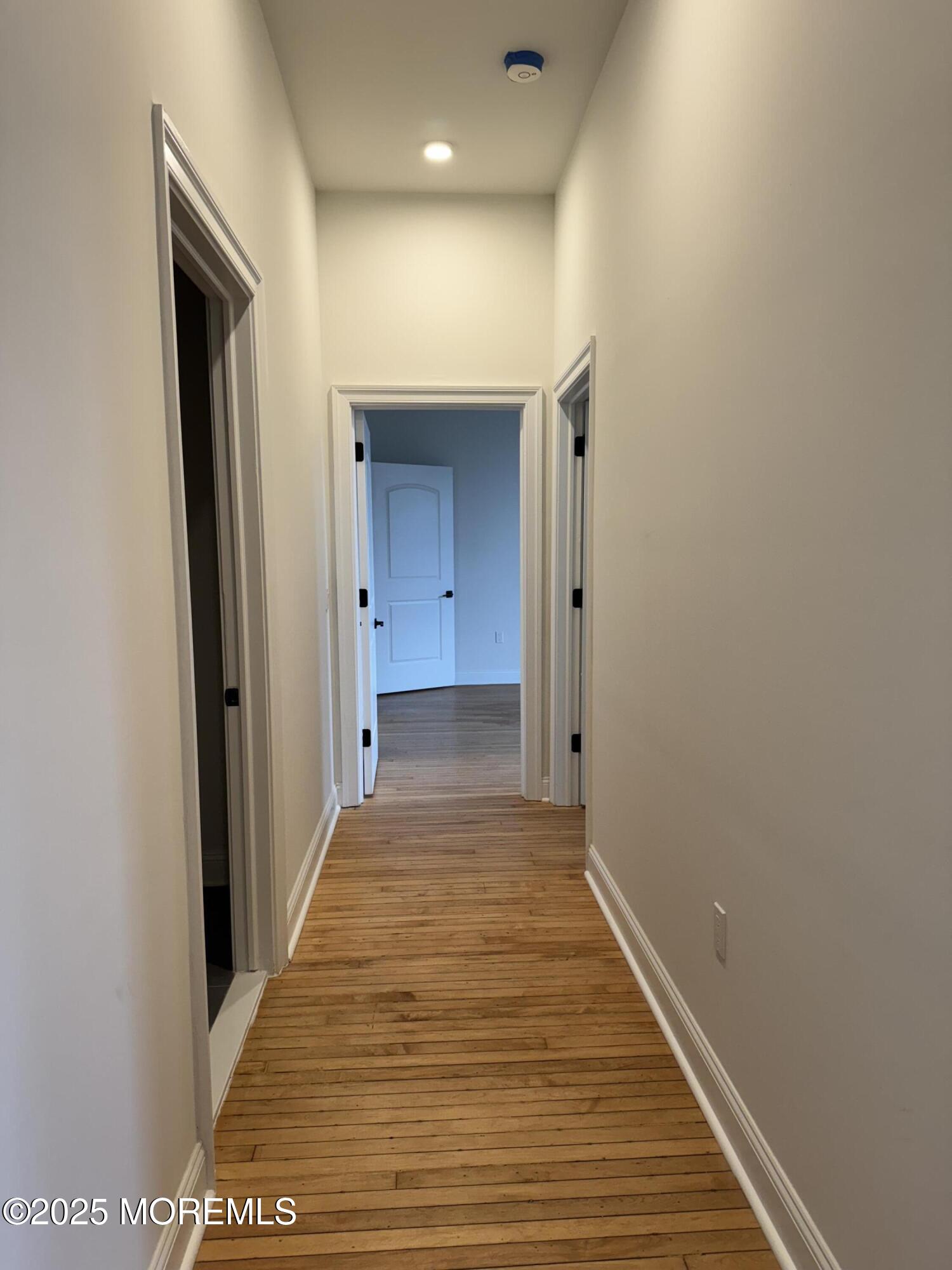 179 Chelsea Avenue, Unit 404 Long Branch, NJ 07740 - Photo 4 of 7 a view of a hallway with wooden floor