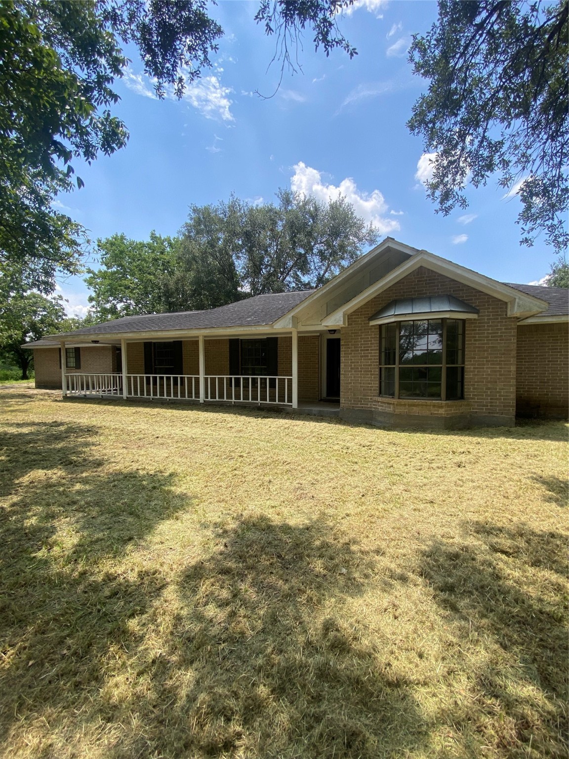 a house with trees in the background