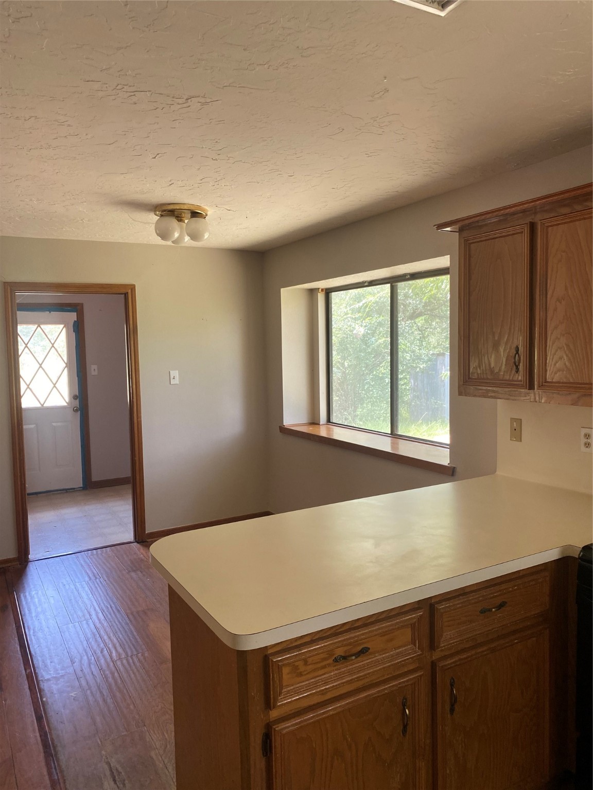8720 Janda Road Fairchilds, TX 77469 - Photo 4 of 13 a view of a kitchen with wooden floor and staircase