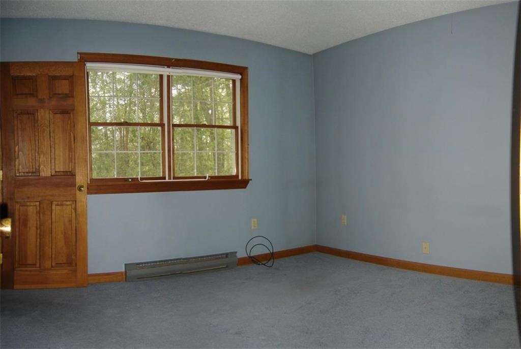129 Castle Island Road Belgrade, ME 04917 - Photo 13 of 29 MASTER BEDROOM AND ENTRY TO MASTER BATH