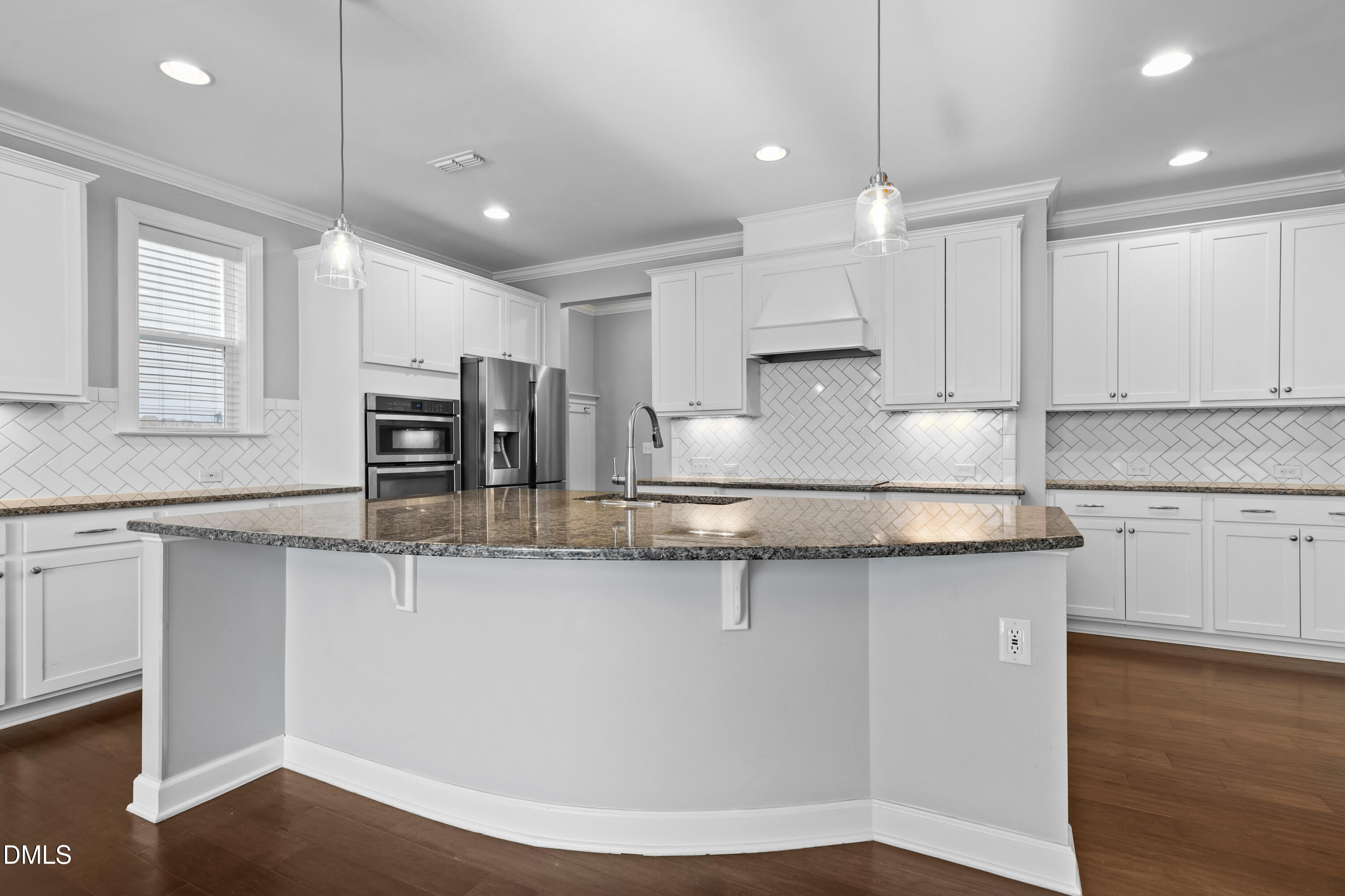 2039 Travern Drive Raleigh, NC 27603 - Photo 11 of 49 a kitchen with stainless steel appliances granite countertop a sink a stove and a wooden floors