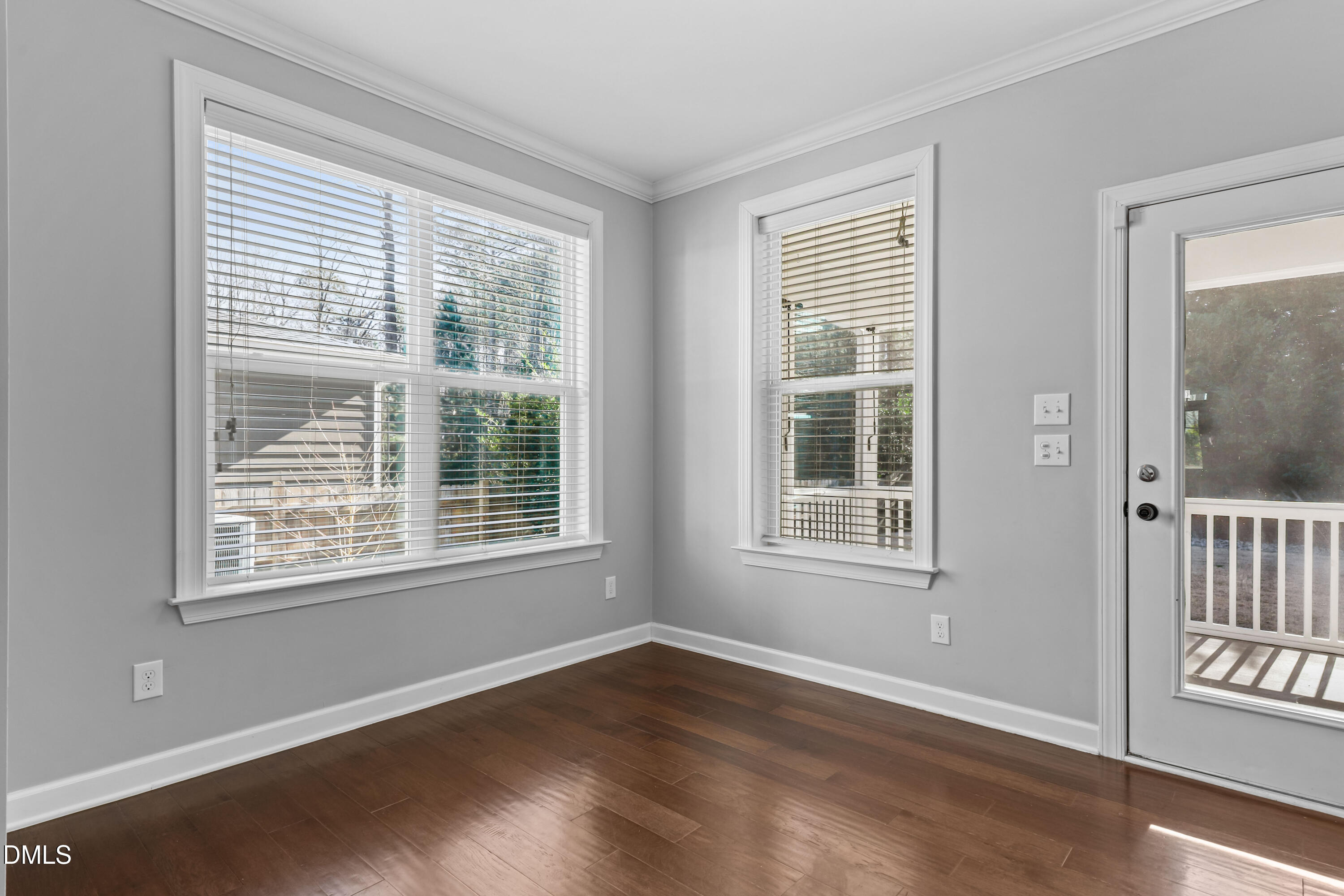 2039 Travern Drive Raleigh, NC 27603 - Photo 20 of 49 a view of an empty room with wooden floor and windows