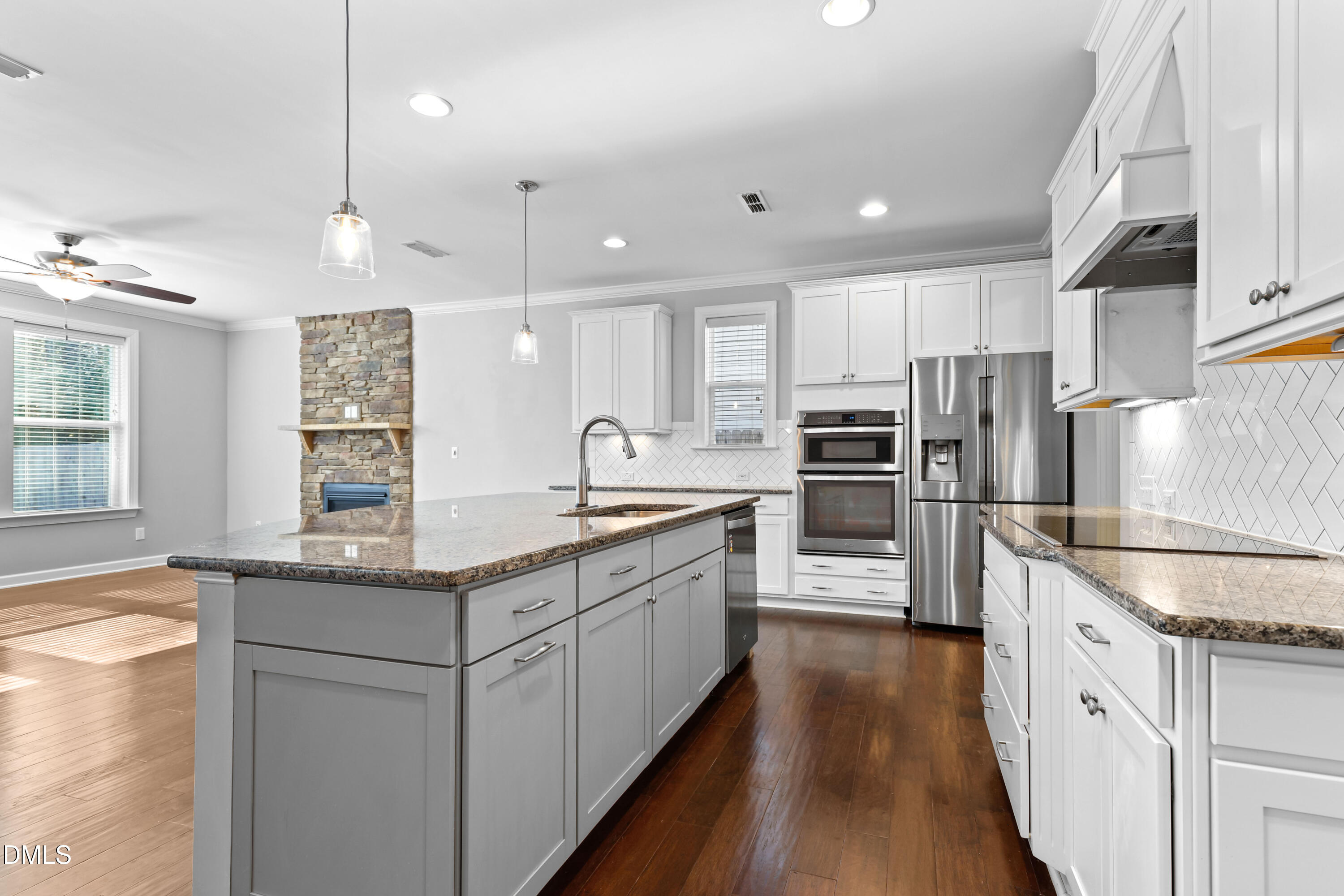2039 Travern Drive Raleigh, NC 27603 - Photo 7 of 49 a modern kitchen with stainless steel appliances granite countertop a sink stove and refrigerator