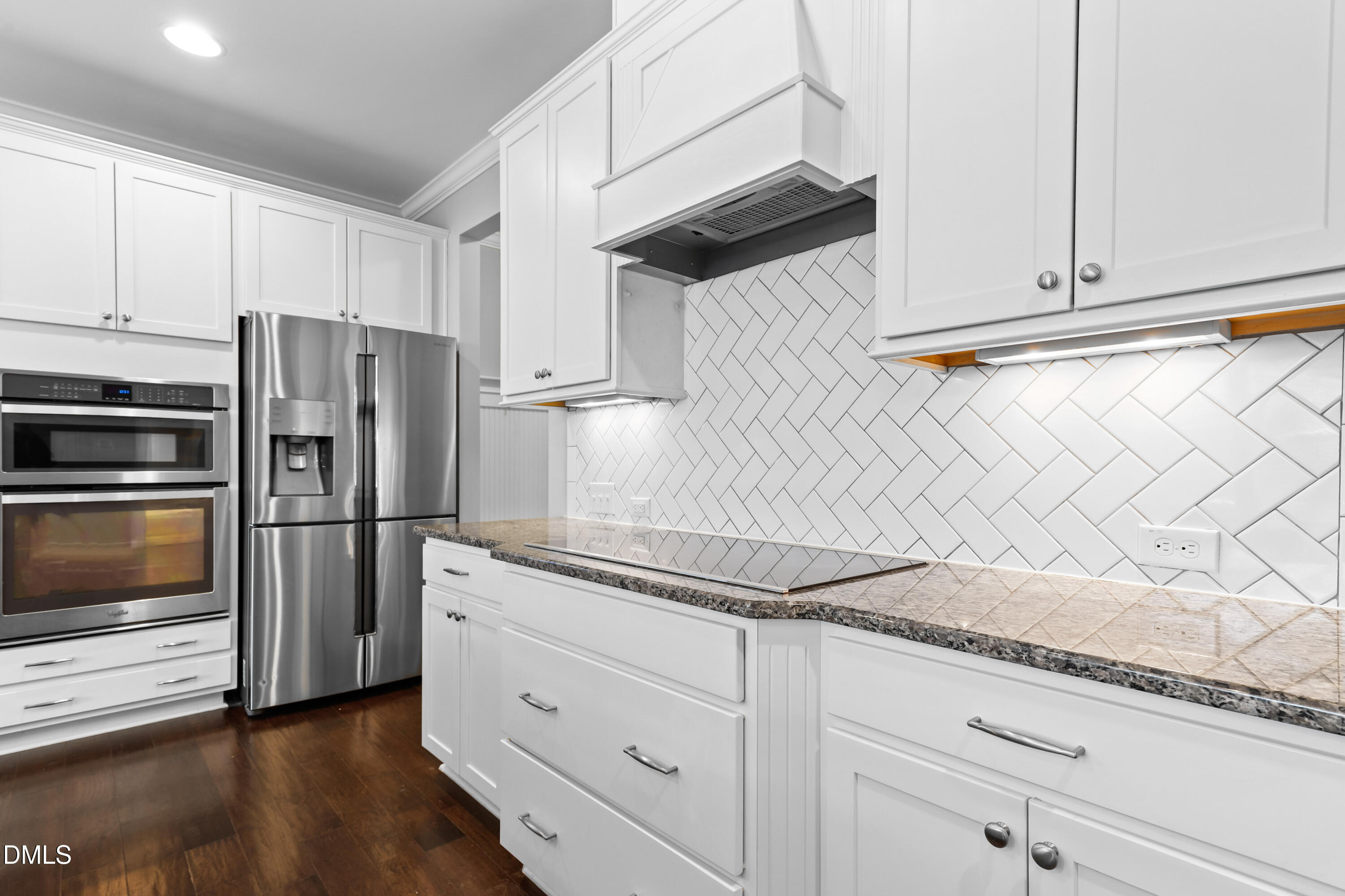 2039 Travern Drive Raleigh, NC 27603 - Photo 9 of 49 a kitchen with granite countertop white cabinets and stainless steel appliances