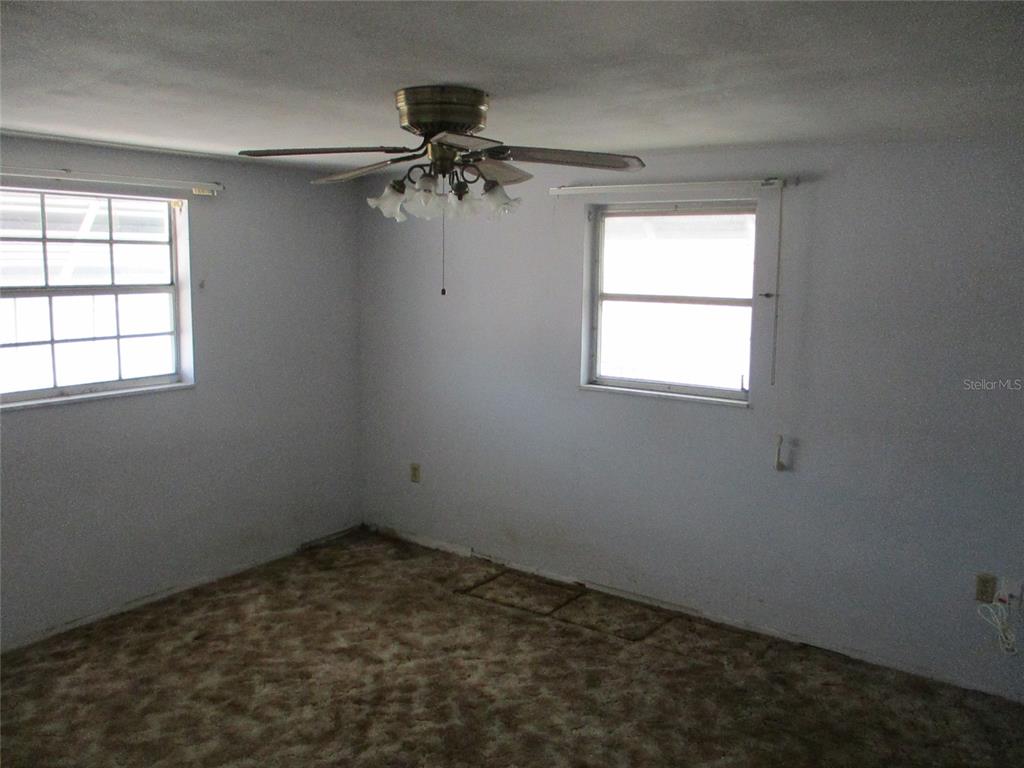 7403 Heather Street New Port Richey, FL 34653 - Photo 14 of 16 an empty room with a window