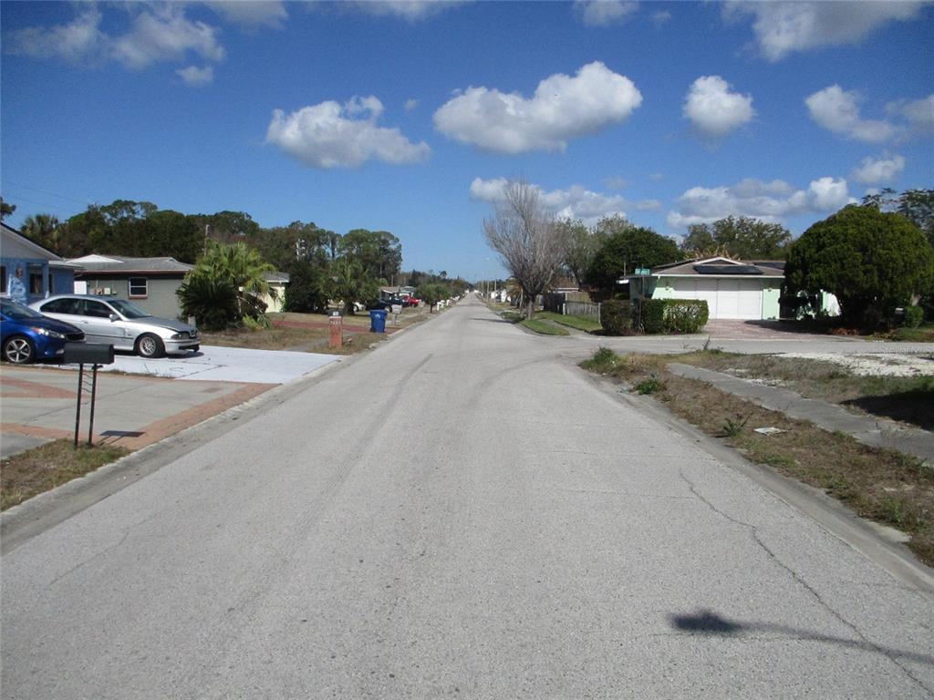 7403 Heather Street New Port Richey, FL 34653 - Photo 2 of 16 a view of a street with a building in the background