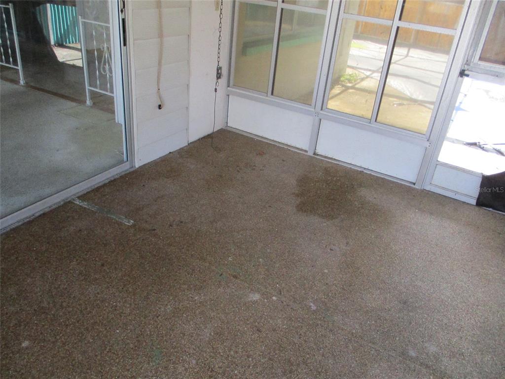 7403 Heather Street New Port Richey, FL 34653 - Photo 4 of 16 a view of an empty room and window