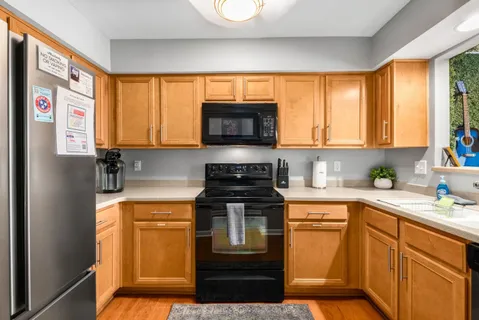 a bedroom with a bed and a furniture