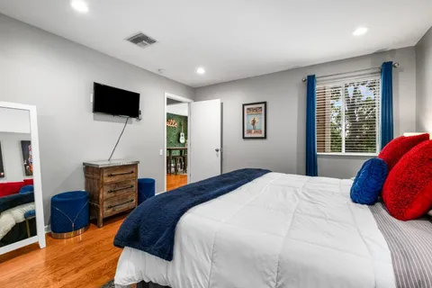 a bedroom with a bed and cabinets