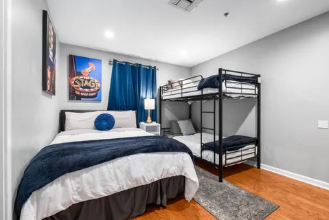 a bedroom with a bed and a dresser