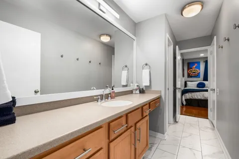 a bathroom with a toilet sink and shower