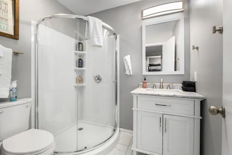 a view of hallway with paintings on the wall