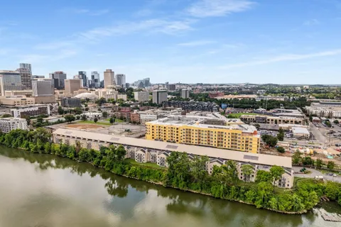 a view of a lake with a city skyline in the background