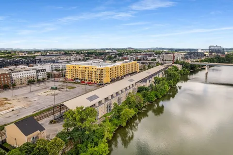 an aerial view of a city with lake view